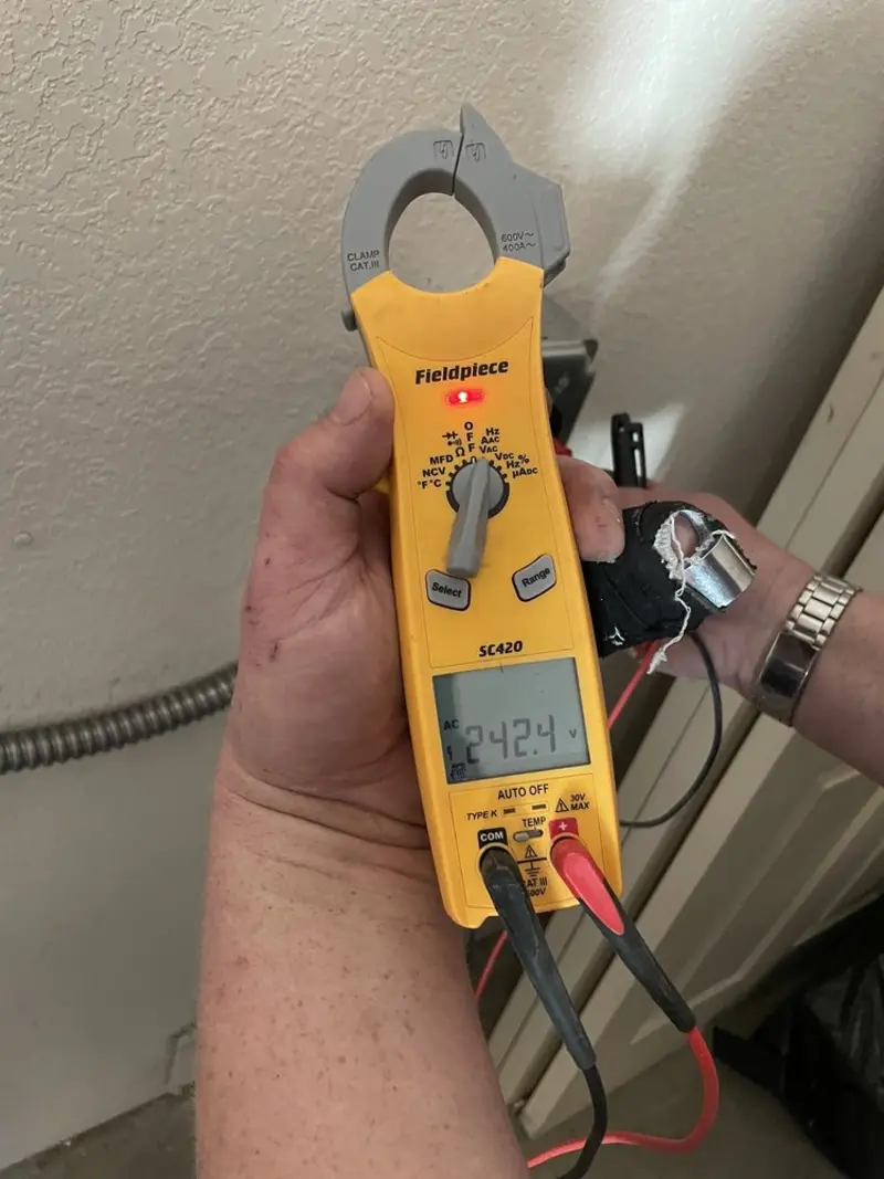 Voltage testing with clamp meter during Aluminum Wiring Replacement in Pella